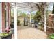 Outdoor patio space with a pergola, grill, seating area, and view of the landscaped yard at 9 Hayden Pond Ln, Chapel Hill, NC 27517