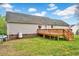 Rear view of home featuring a wood deck, lawn and fence at 91 Buckingham Ct, Smithfield, NC 27577