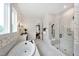 Bright primary bathroom with a soaking tub, walk-in shower, and attractive wallpaper at Lot 1 Northpointe Farms Trl, Efland, NC 27243
