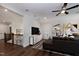 Open-concept living room with a ceiling fan, comfortable seating, and contemporary art at Lot 1 Northpointe Farms Trl, Efland, NC 27243