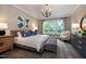 Bright main bedroom featuring a cozy chair by the window, soft lighting, and coordinated décor creating a retreat at Lot 1 Northpointe Farms Trl, Efland, NC 27243