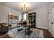 Elegant home office with stylish desk, shelving, and a comfortable armchair set on a decorative area rug at Lot 1 Northpointe Farms Trl, Efland, NC 27243