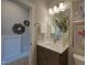 Cozy bathroom with modern fixtures, neutral tones, and a decorative mirror at Lot 2 Northpointe Farms Trl, Efland, NC 27243
