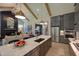 Spacious kitchen featuring an island, stainless steel appliances, gray cabinets, hardwood floors and an open floor plan at Lot 2 Northpointe Farms Trl, Efland, NC 27243