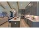 Modern kitchen featuring an island, gray cabinets, stainless steel appliances, hardwood floors, and an open floor plan at Lot 2 Northpointe Farms Trl, Efland, NC 27243