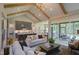 Open-concept living space featuring a kitchen island, living room with fireplace, hardwood floors, and exposed beams at Lot 2 Northpointe Farms Trl, Efland, NC 27243