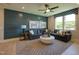 Spacious living room with modern decor, large windows, comfortable seating, and a stylish rug at Lot 2 Northpointe Farms Trl, Efland, NC 27243