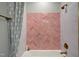 Stylish tub and shower with pink tile, gold fixtures, and marble surround evokes spa-like luxury at Lot 2 Northpointe Farms Trl, Efland, NC 27243