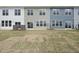 Backyard view of the property showcasing the layout with newly installed sod at 100 Ripple Way # 317, Clayton, NC 27520