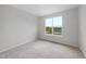 Neutral bedroom with plush carpet and a window showcasing the outdoors at 100 Ripple Way # 317, Clayton, NC 27520