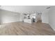 Spacious open floor plan featuring wood-look floors and natural light at 100 Ripple Way # 317, Clayton, NC 27520