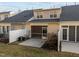 Backyard view featuring the home's exterior, a screened-in patio, and some grass at 10133 Bessborough Dr, Raleigh, NC 27617