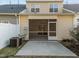 Backyard exterior view, showing a screened porch and neutral siding at 10133 Bessborough Dr, Raleigh, NC 27617