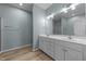 Well-lit bathroom with double sink vanity at 10133 Bessborough Dr, Raleigh, NC 27617