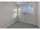 Bright bedroom features neutral walls, carpeted floor, and a large window at 10133 Bessborough Dr, Raleigh, NC 27617