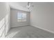 Neutral bedroom features carpet, a window, and plenty of natural light at 10133 Bessborough Dr, Raleigh, NC 27617
