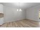 Bright dining area with hardwood floors and neutral paint at 10133 Bessborough Dr, Raleigh, NC 27617