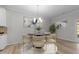 Modern dining room featuring elegant lighting and contemporary decor at 10133 Bessborough Dr, Raleigh, NC 27617