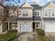 Charming two-story townhome featuring a one car garage and traditional architectural details at 10133 Bessborough Dr, Raleigh, NC 27617