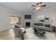Cozy living room with a fireplace, ceiling fan and ample space for seating at 10133 Bessborough Dr, Raleigh, NC 27617