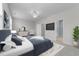 Comfortable main bedroom featuring a bed, TV, ceiling fan, and ensuite bathroom at 10133 Bessborough Dr, Raleigh, NC 27617