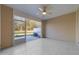Enclosed screened porch with tile flooring and a ceiling fan at 10133 Bessborough Dr, Raleigh, NC 27617
