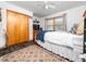 Bedroom featuring a ceiling fan, wood-look flooring, double closet and natural light from the window at 104 Black Cloud Dr, Louisburg, NC 27549