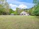 Charming home with a covered front porch, well-manicured lawn, and mature trees at 104 Black Cloud Dr, Louisburg, NC 27549