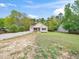 Charming home with a covered front porch, gravel driveway, and well-manicured lawn at 104 Black Cloud Dr, Louisburg, NC 27549