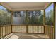 Spacious screened-in porch offering a serene view of the wooded backyard at 106 S Harper Faith Way, Benson, NC 27504