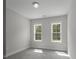 Empty bedroom featuring carpet flooring and two windows that provide lots of natural light at 106 S Harper Faith Way, Benson, NC 27504