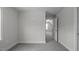 Bedroom with carpet, featuring an open doorway and lots of wall space for flexible arrangement at 106 S Harper Faith Way, Benson, NC 27504