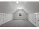 Cozy bonus room with carpet, window, and storage closet, perfect for a den, office, or playroom at 106 S Harper Faith Way, Benson, NC 27504
