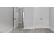 Hallway leading into a bedroom area featuring carpet flooring and traditional doors at 106 S Harper Faith Way, Benson, NC 27504