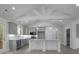 Kitchen with granite countertops, white cabinets, stainless appliances and decorative ceiling beams at 106 S Harper Faith Way, Benson, NC 27504