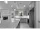 Kitchen with granite countertops, gray cabinets, stainless appliances and open to the living room at 106 S Harper Faith Way, Benson, NC 27504