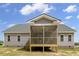 Back view of the home with a large screened-in back porch at 106 S Harper Faith Way, Benson, NC 27504