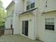 Exterior view of the home showing a deck and slider to the backyard with string lights at 109 Bright Shade Ct, Holly Springs, NC 27540