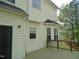 Exterior view of home featuring a deck with string lights and neutral colored siding at 109 Bright Shade Ct, Holly Springs, NC 27540