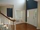 Elegant foyer with hardwood floors, French doors, and a view of the staircase and transom window at 109 Bright Shade Ct, Holly Springs, NC 27540