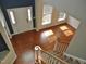 Spacious foyer with hardwood floors, a staircase, and natural light from large windows at 109 Bright Shade Ct, Holly Springs, NC 27540