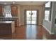 Bright kitchen flows into dining area with sliding glass doors leading to an outdoor deck, blending indoor and outdoor spaces at 109 Bright Shade Ct, Holly Springs, NC 27540