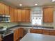 Efficient kitchen with updated stainless steel appliances, plentiful storage, and easy-to-clean countertops at 109 Bright Shade Ct, Holly Springs, NC 27540