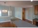 Expansive living area showing a well-lit room with hardwood flooring and open access to kitchen at 109 Bright Shade Ct, Holly Springs, NC 27540