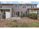 The home features a private backyard patio perfect for outdoor entertaining with lush landscaping at 11011 Southwalk Ln, Raleigh, NC 27614