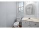 Half bathroom featuring a single vanity, toilet and framed mirror at 11011 Southwalk Ln, Raleigh, NC 27614