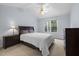 Bedroom with ceiling fan, side tables, and a comfortable mattress at 11011 Southwalk Ln, Raleigh, NC 27614