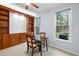 Cozy dining area with built-in shelving, a small table set and natural light at 11011 Southwalk Ln, Raleigh, NC 27614