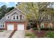 Beautiful two-story home with brick accents, a two-car garage, and a well-manicured lawn at 11011 Southwalk Ln, Raleigh, NC 27614