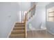 Bright foyer featuring wooden stairs, neutral walls and a tiled floor at 11011 Southwalk Ln, Raleigh, NC 27614